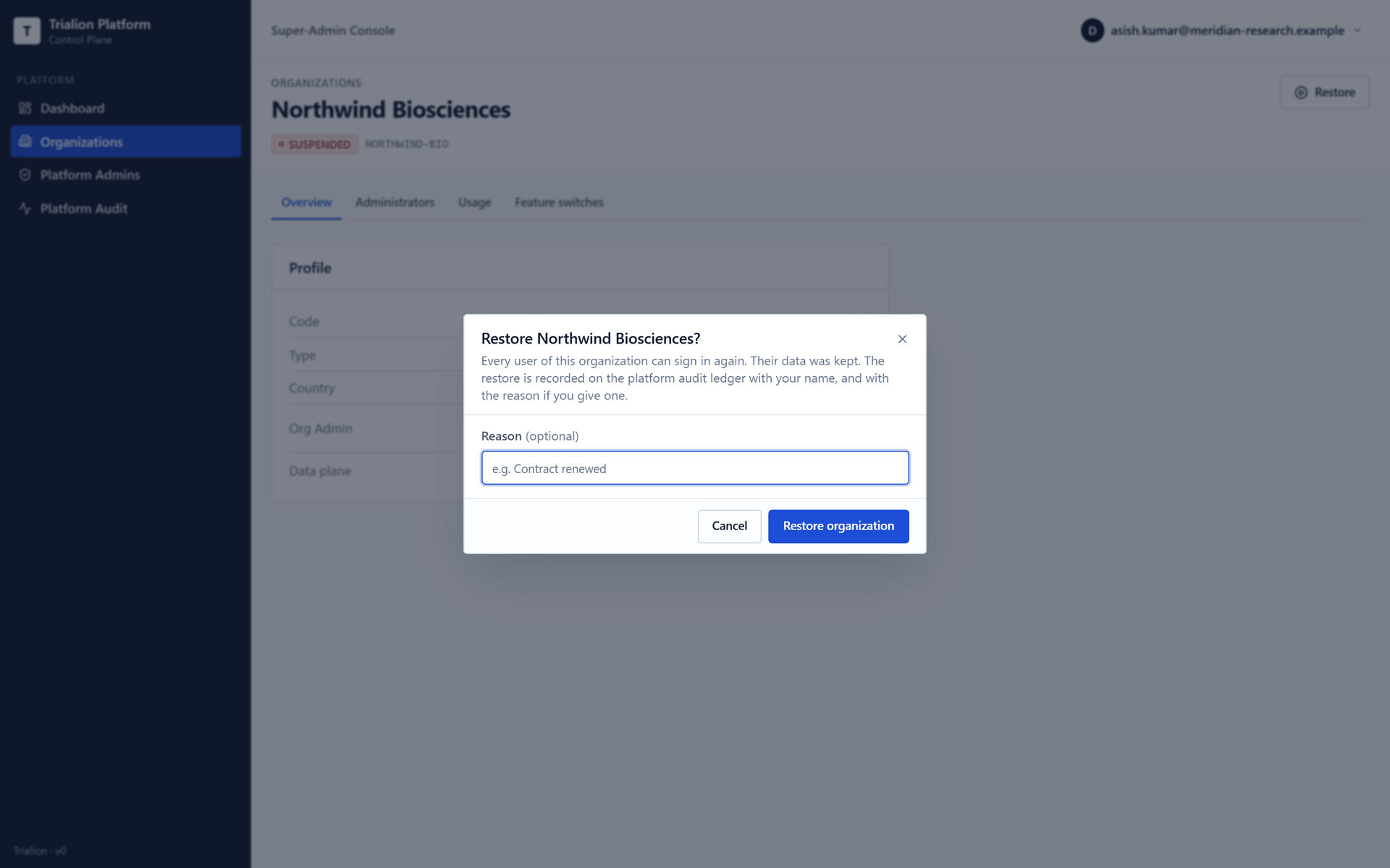 The Restore dialog of a suspended organization, with an optional reason.